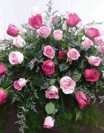 Mixed pink rose casket spray